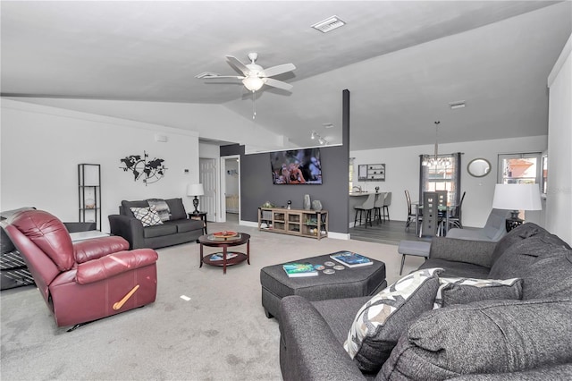 carpeted living room with vaulted ceiling and ceiling fan