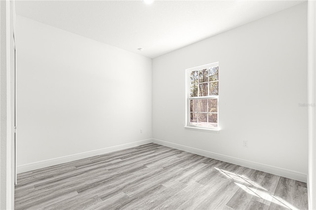 unfurnished room featuring light hardwood / wood-style floors