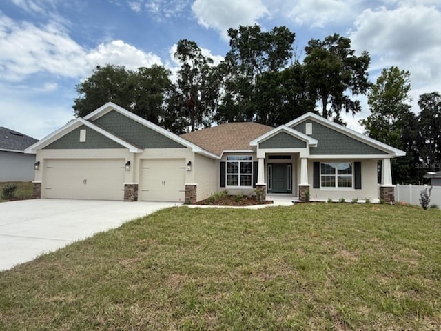 7 NW 45th Loop, Ocala, FL 34470 - craftsman-style house featuring an attached garage, driveway, and stucco siding