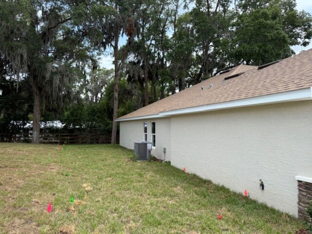 7 NW 45th Loop, Ocala, FL 34470 - view of grassy yard with central AC unit