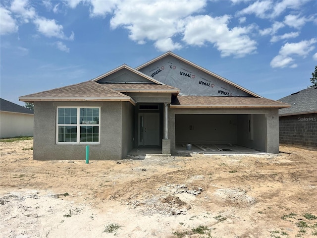 4373 SW 90th Pl, Ocala, FL 34476 - property in mid-construction with stucco siding, roof with shingles, and a garage