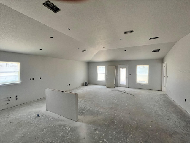 4373 SW 90th Pl, Ocala, FL 34476 - unfurnished room featuring lofted ceiling and a textured ceiling