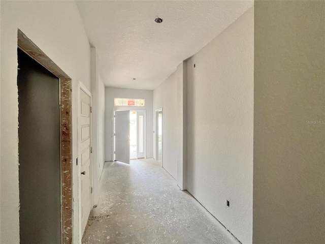4373 SW 90th Pl, Ocala, FL 34476 - hallway with a textured wall and a textured ceiling