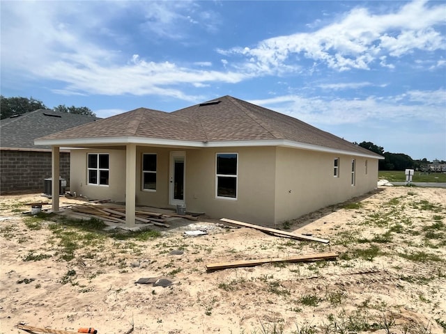 4373 SW 90th Pl, Ocala, FL 34476 - rear view of house featuring roof with shingles, stucco siding, and a patio area