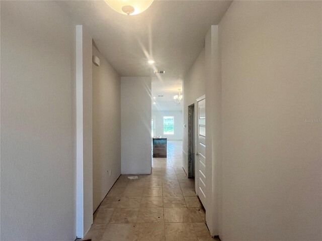 4373 SW 90th Pl, Ocala, FL 34476 - hallway with a chandelier