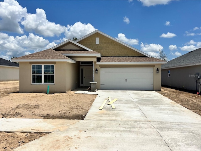 4373 SW 90th Pl, Ocala, FL 34476 - single story home with roof with shingles, driveway, and stucco siding