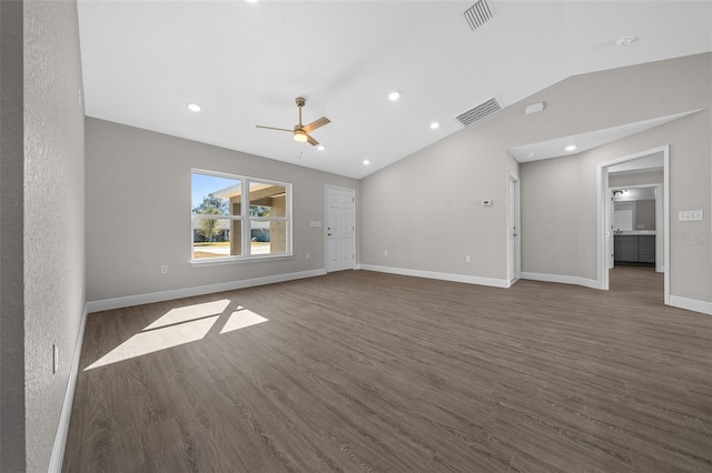 unfurnished room featuring dark hardwood / wood-style flooring, lofted ceiling, and ceiling fan