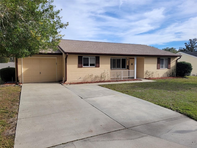 single story home featuring a garage, covered porch, and a front yard