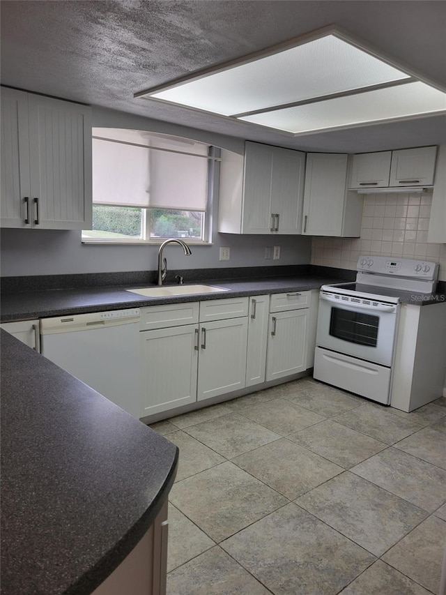 kitchen with sink, white cabinetry, a textured ceiling, white appliances, and backsplash