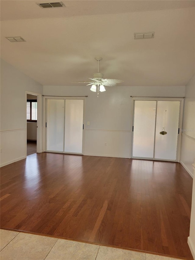 spare room featuring ceiling fan and hardwood / wood-style floors