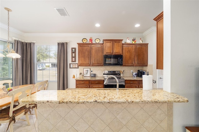 kitchen with pendant lighting, tasteful backsplash, kitchen peninsula, light stone countertops, and stainless steel electric range