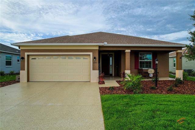 view of front of home with a garage and a front yard