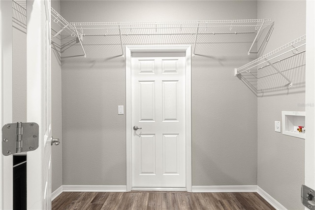 clothes washing area featuring washer hookup and dark hardwood / wood-style floors