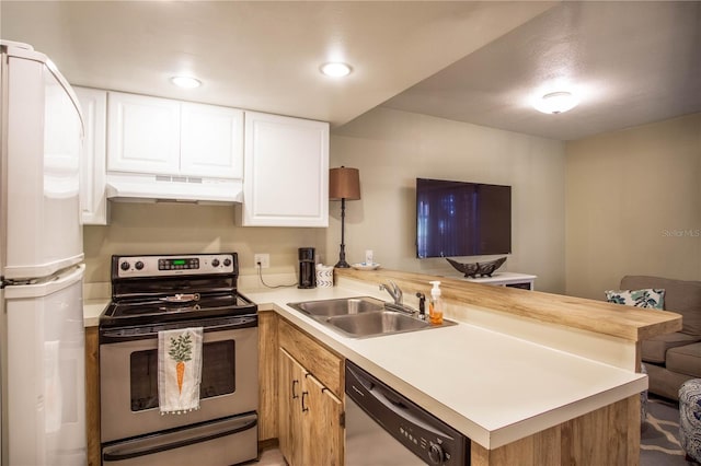 kitchen featuring white cabinetry, sink, kitchen peninsula, and appliances with stainless steel finishes