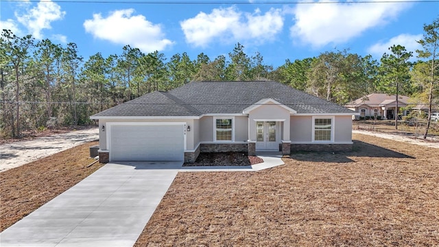 view of front of home featuring french doors and a garage