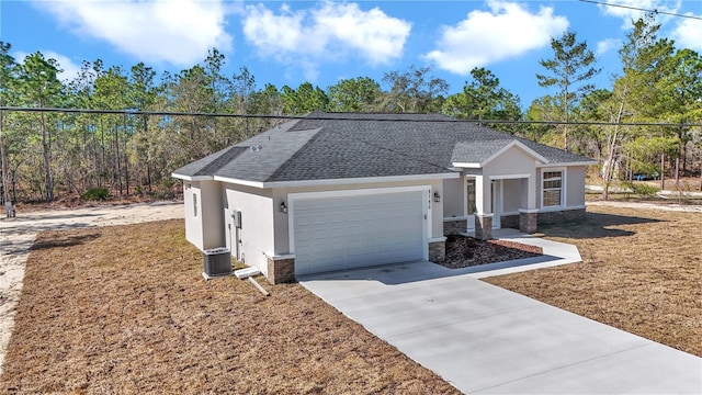 single story home with a garage and central AC unit