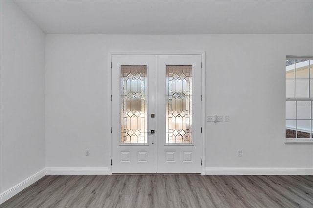 entryway with french doors and hardwood / wood-style floors