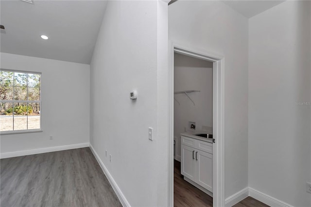 unfurnished bedroom featuring sink and light hardwood / wood-style floors