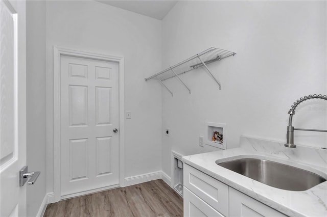 laundry room with sink, cabinets, electric dryer hookup, washer hookup, and light hardwood / wood-style floors