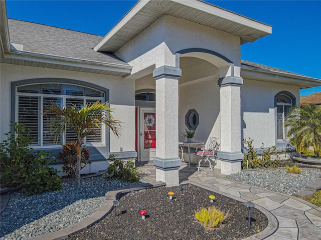 entrance to property featuring a patio