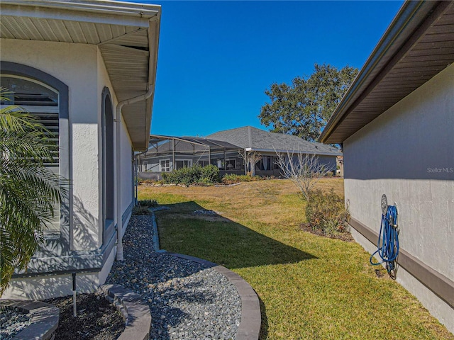 view of yard featuring glass enclosure