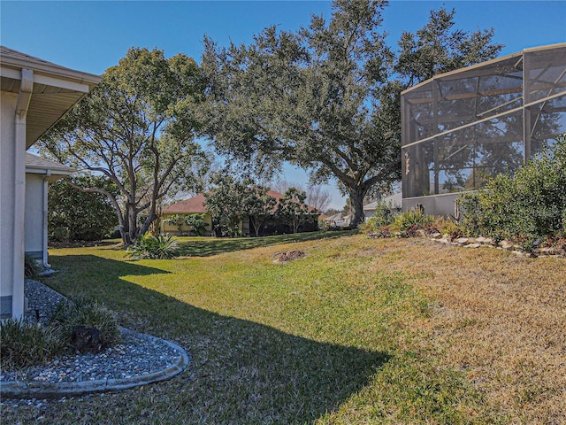 view of yard with a lanai