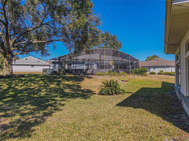 view of yard featuring a lanai