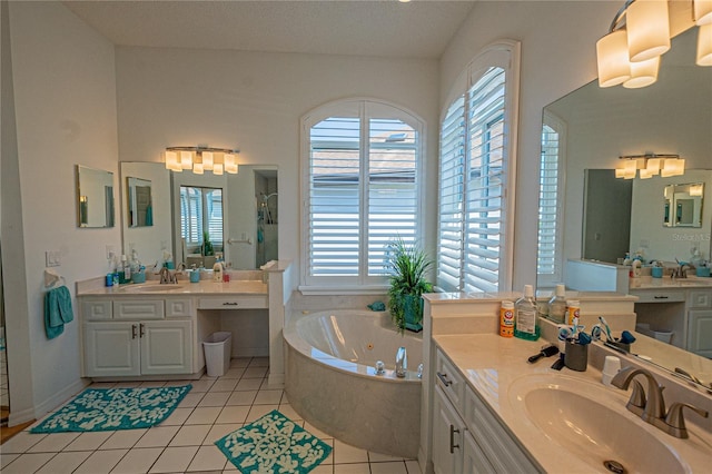 bathroom featuring vanity, a bathing tub, and tile patterned floors