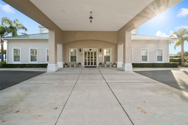 property entrance featuring french doors