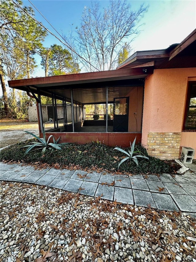 exterior space featuring a sunroom