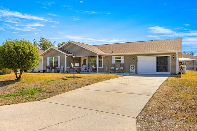 ranch-style home with a garage, a front yard, and covered porch