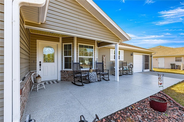 view of patio featuring a garage, central AC, and a porch