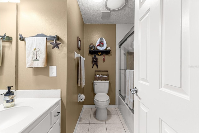 full bathroom with toilet, combined bath / shower with glass door, a textured ceiling, vanity, and tile patterned flooring