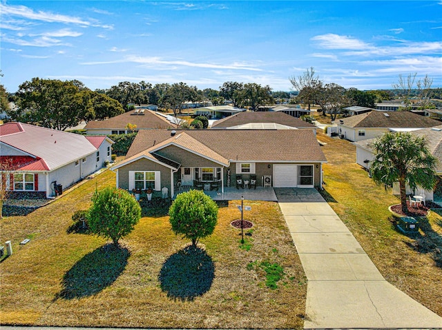 view of front of property with a garage and a front yard