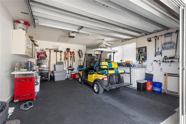 garage with a garage door opener and a workshop area