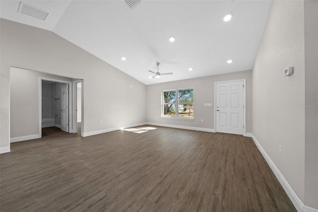 unfurnished living room with vaulted ceiling, dark wood-type flooring, and ceiling fan