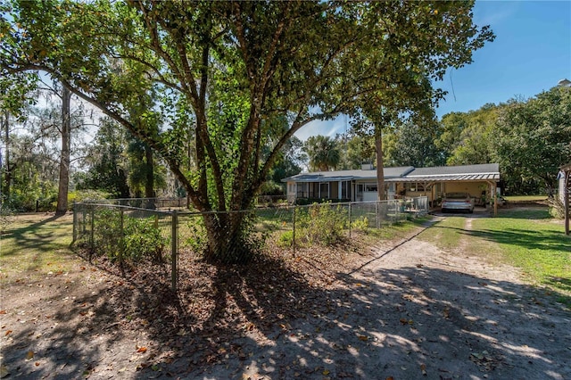 view of front of property featuring a carport