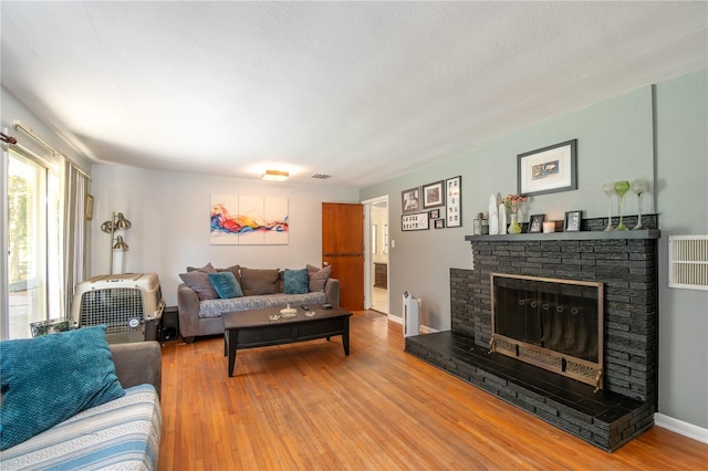 living room with hardwood / wood-style flooring and radiator heating unit