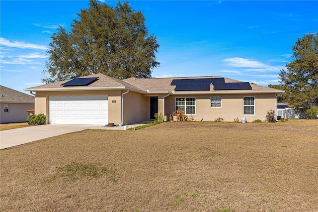 ranch-style home featuring a garage and a front yard