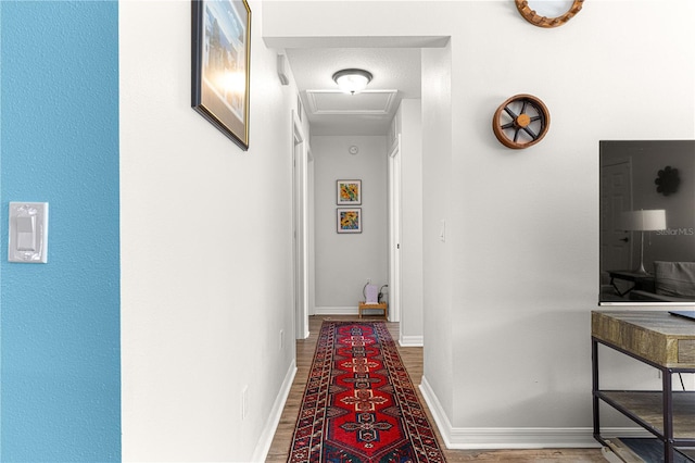 corridor featuring hardwood / wood-style flooring