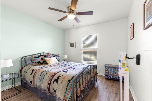 bedroom featuring hardwood / wood-style flooring and ceiling fan