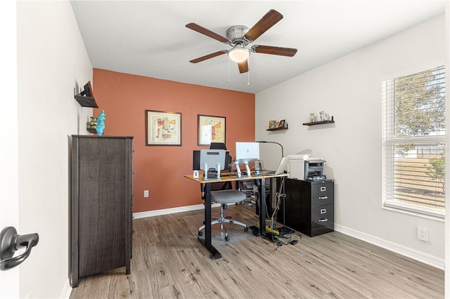 office area featuring light hardwood / wood-style floors and ceiling fan