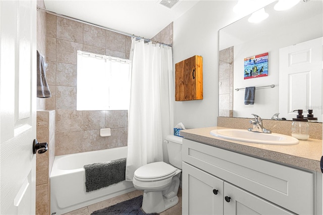 full bathroom with tile patterned flooring, vanity, shower / tub combo with curtain, and toilet