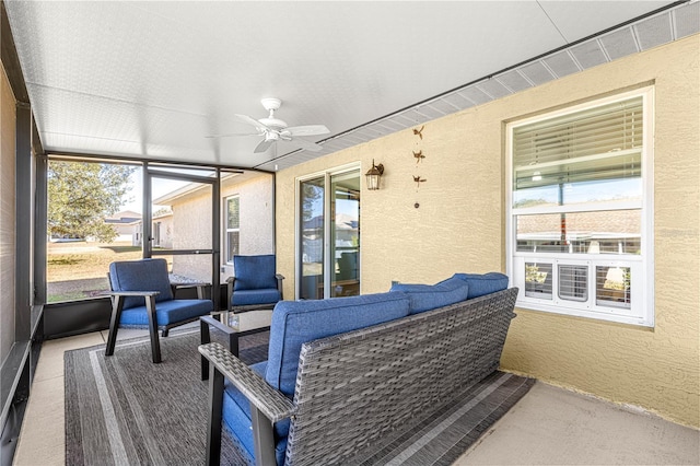 sunroom / solarium with ceiling fan and a healthy amount of sunlight