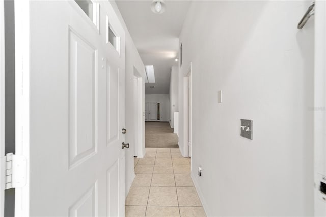 hall with light tile patterned flooring