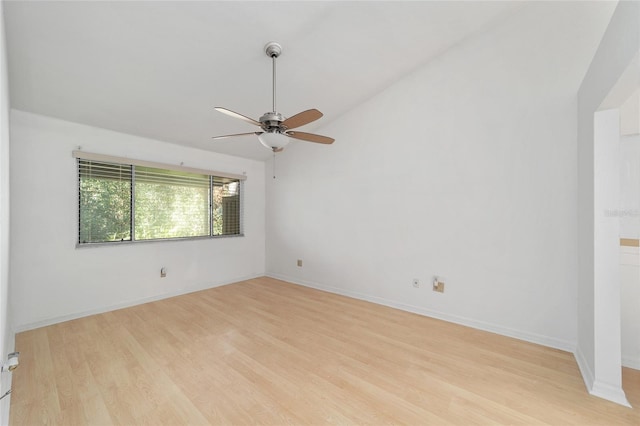 spare room with ceiling fan, lofted ceiling, and light hardwood / wood-style floors