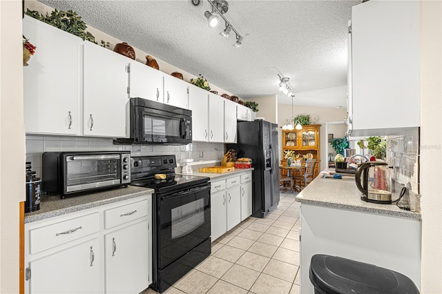 kitchen featuring light tile patterned flooring, black appliances, a textured ceiling, white cabinets, and backsplash