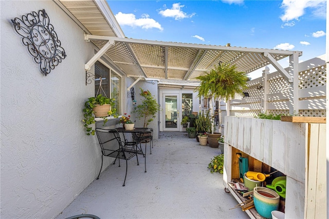 view of patio / terrace with french doors and a pergola