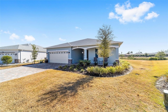 view of front of house with a garage and a front yard