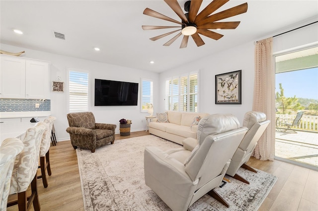 living room featuring light hardwood / wood-style flooring and plenty of natural light